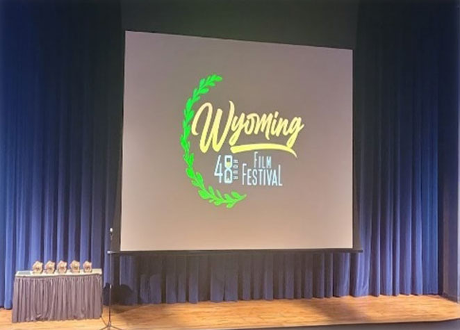 Photo of the stage with screen in the Surbrugg/Prentice Auditorium