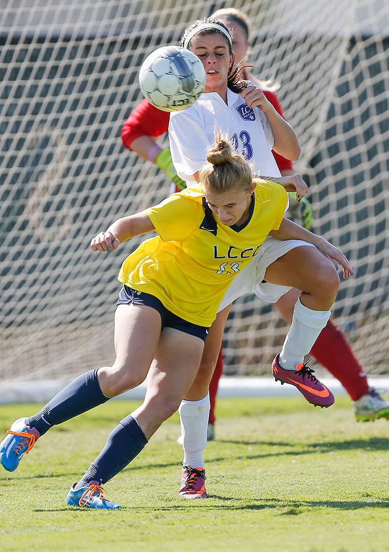 Laramie County Community College's Erin Elder collides with Kori Swanson of Lewis & Clark College during first half action at Titans Stadium in Melbourne, Florida.