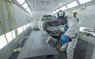 LCCC auto body student Gus Alfaro of St. Helena, Calif., sprays sealant on a tailgate in the program’s paint booth. 