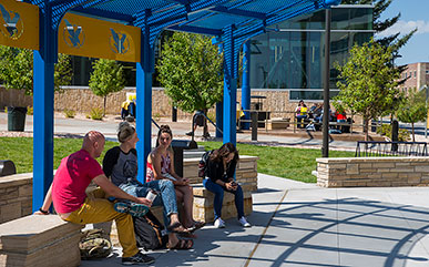 students sitting in McIlvaine Plaza on campus