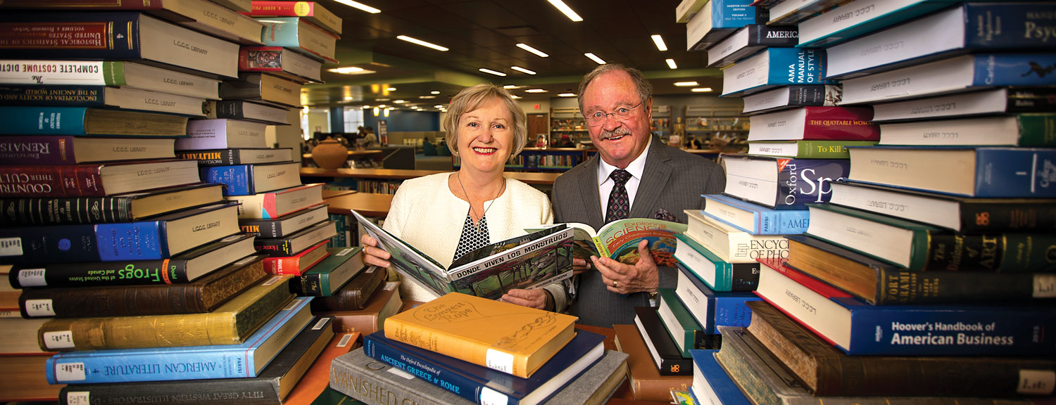Randy and Yvonne Ludden in the Ludden Library, surrounded by books