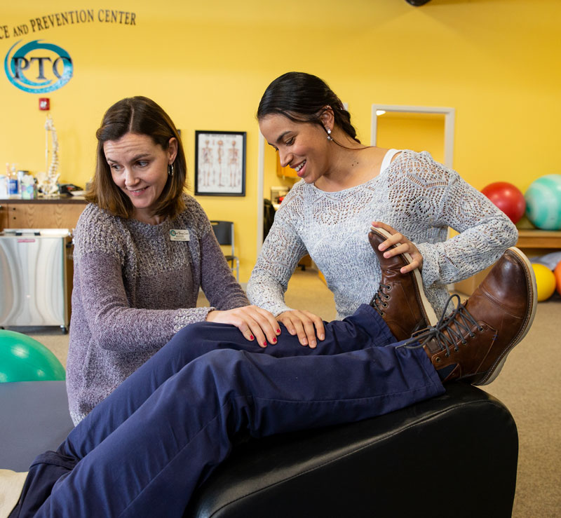 Physical therapist Mandy Keefe (left) guides LCCC student Nicole Johnson during a session at the Physical Therapy Center of Cheyenne.