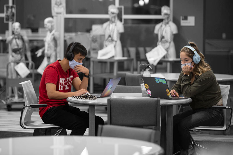 LCCC students  Tung Huynh, left,  and Viviana Hinojosa read  through their class syllabus in the  Ludden Library on the first day of classes.