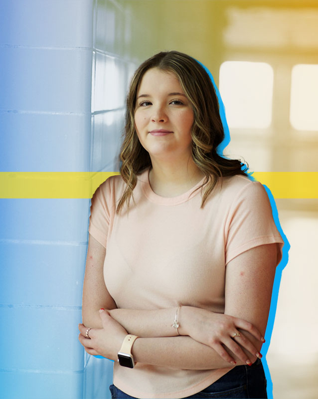 stylized photo of Alora Burkins standing in front of a hallway and door.