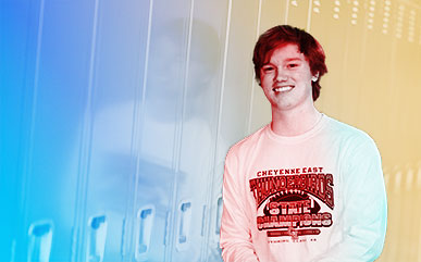 altered photo of high school student Gavin Goff in front of lockers. Photo is altered to make a colorful background around him.