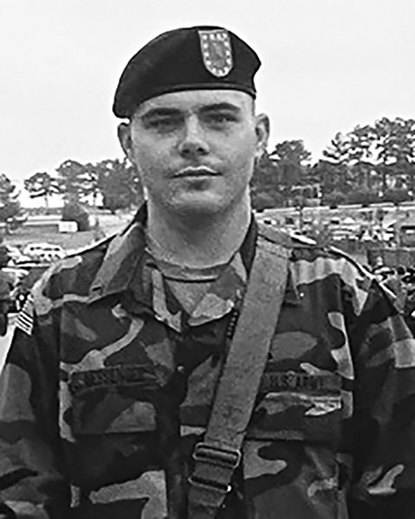 photo of Adam Messenger when he was in the military in his military uniform