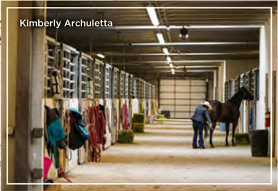 Kimberly Archuletta in the stables with a horse