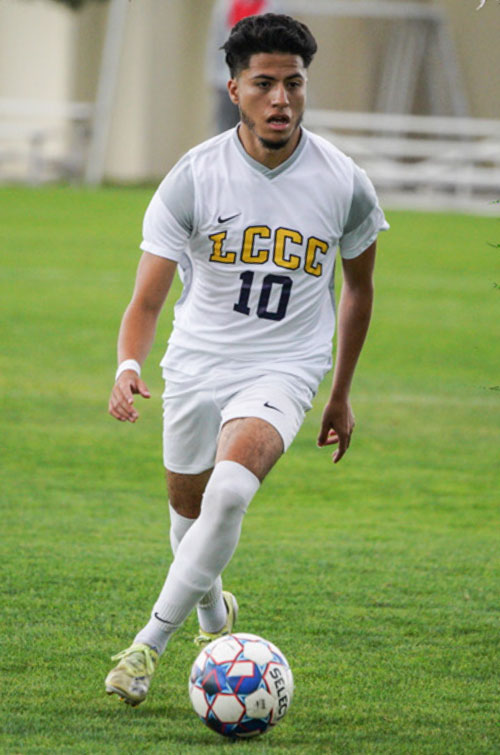 Christian Nunez, a sophomore midfielder for the Men's Soccer field with the ball
