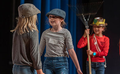 Students on stage during the theater SEEK performance
