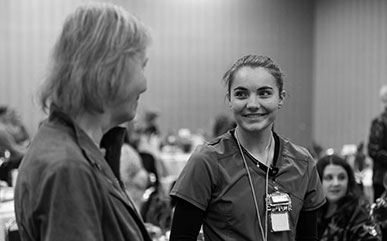 A radiography student talks with LCCC Trustee Carol Merrell during the Scholarship Luncheon.