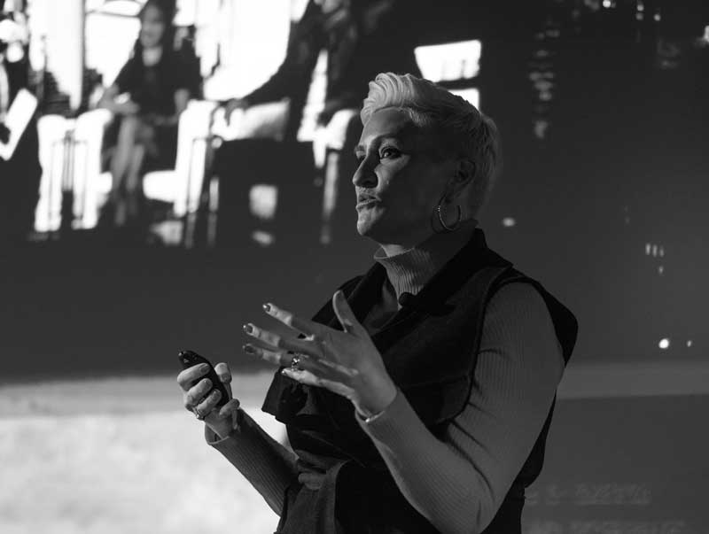 Amanda Brinkman speaking on stage