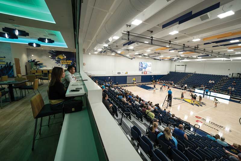 View from the Champions Lounge upstairs in the newly renovated RAC down to the competition gym with a volleyball game going on