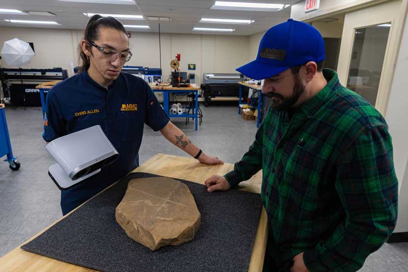 Chris Allen scanning a grave marker