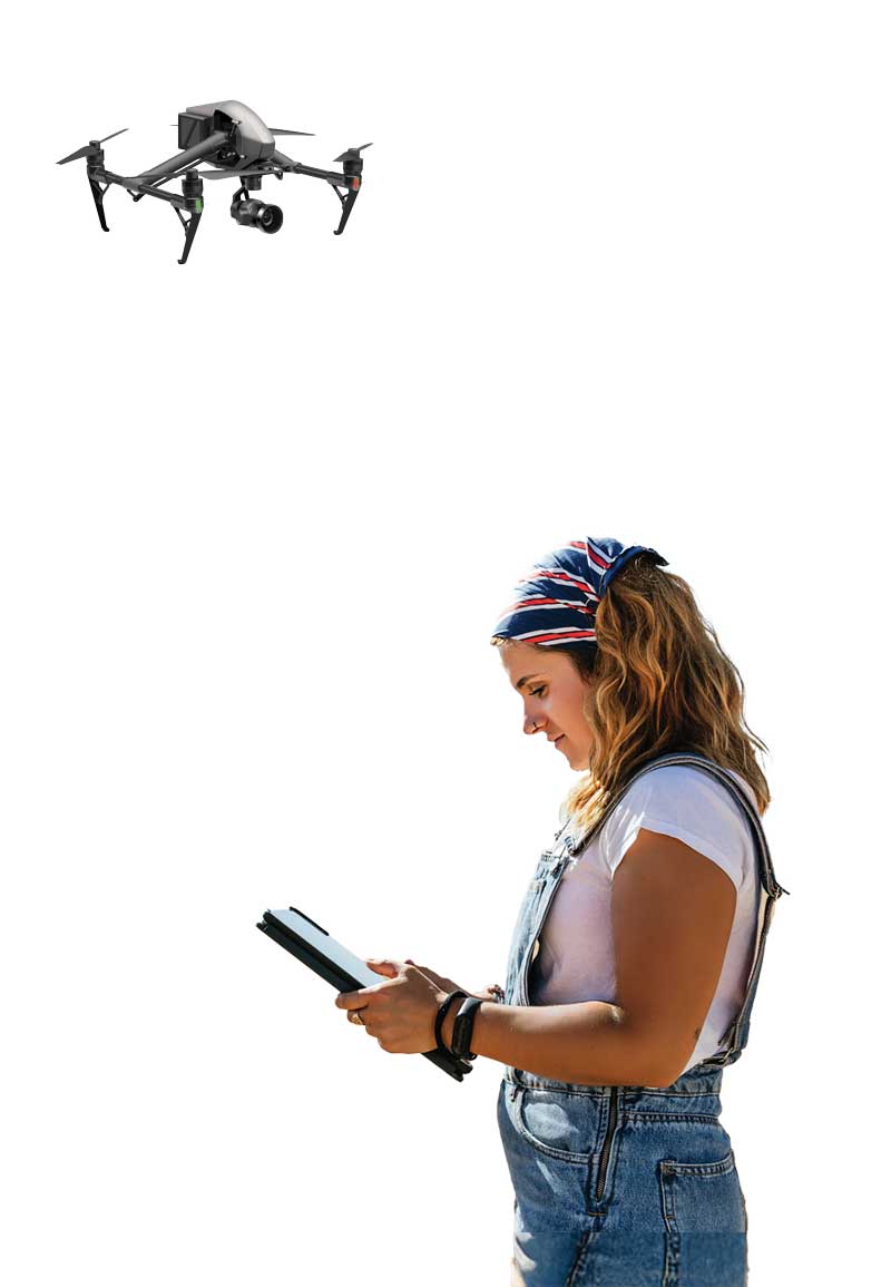 Woman on a tablet with a drone flying overhead