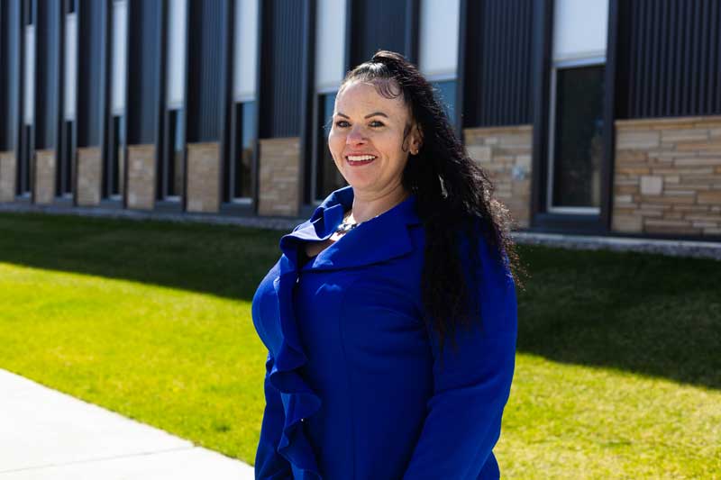 Jennifer Lamblin in front of the Business Building