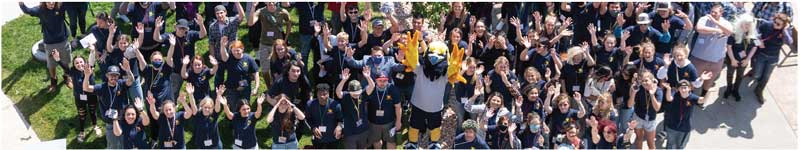 A group of students with the Mascot Talon on campus for The Kickoff, a student event held at the start of each semester.