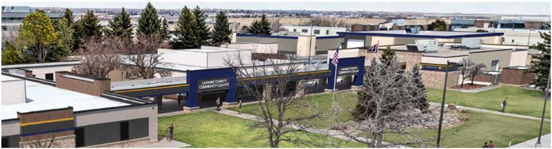 Mockup of the South entrance to the college in front of the Administration Building after the exterior renewal with big blue arches and the college name.