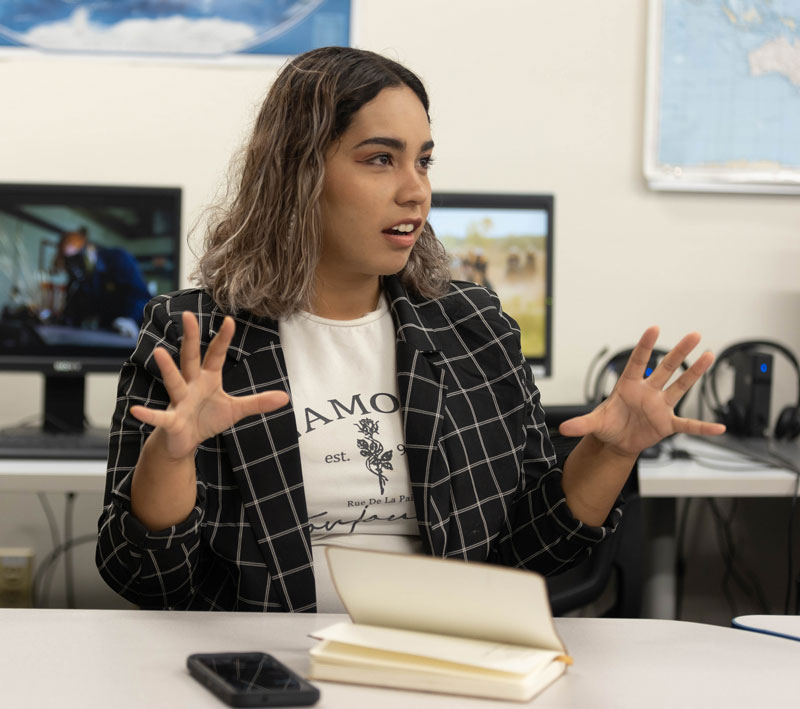 Photo of student speaking in class