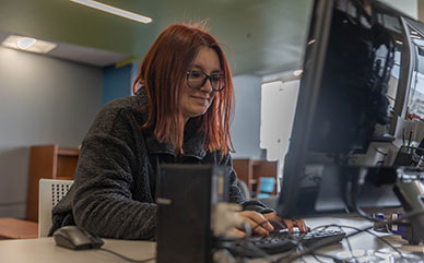 photo of female student at a computer