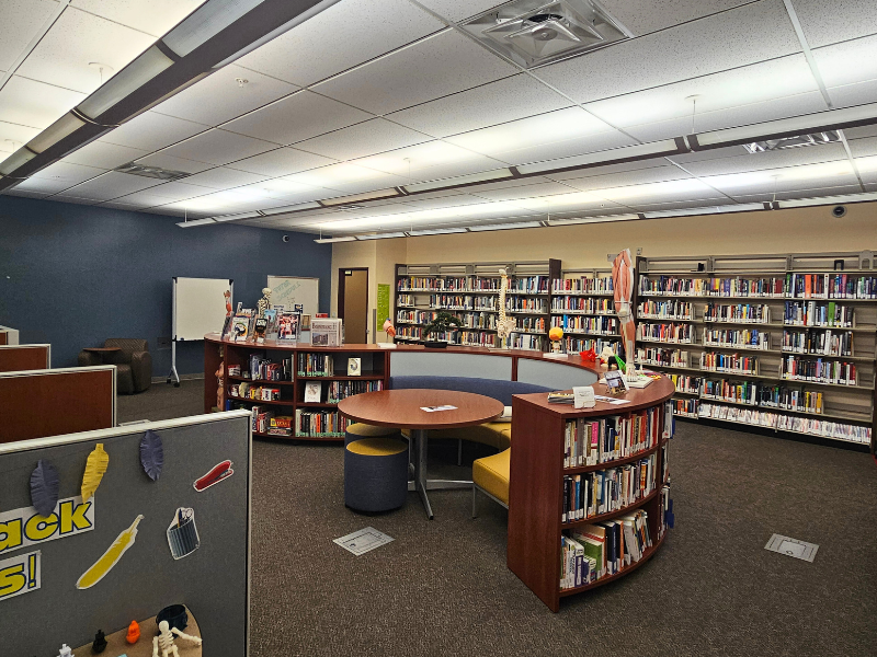 Circular bookshelf with tables and benches