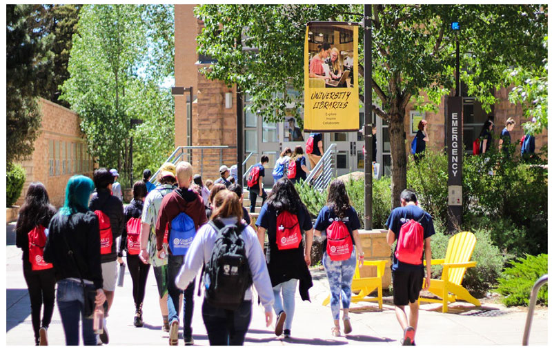 photo of students walking on University of Wyoming campus with backpacks
