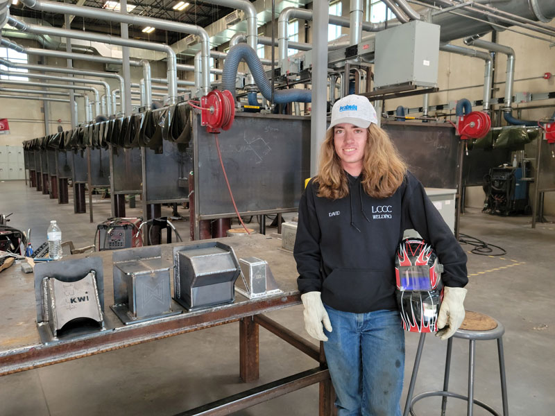 LCCC Welding graduate, David Gordon, stands in front of the series of welds that earned him the title of fourth best welder in the National Skills USA contest this summer.