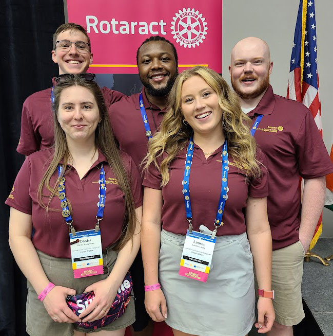 photo of LCCC's student Rotaract participants in their polo shirts lined up at a conference