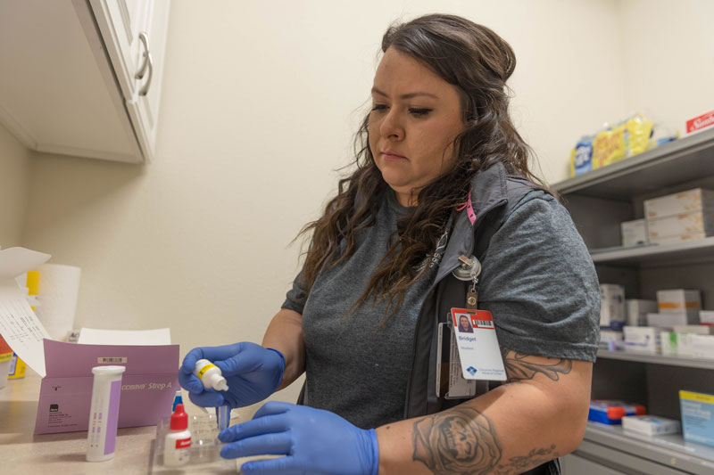 photo of a nurse holding medicine