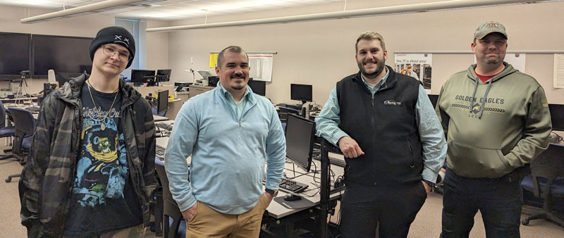 Four LCCC IT Pathway students standing in a computer lab