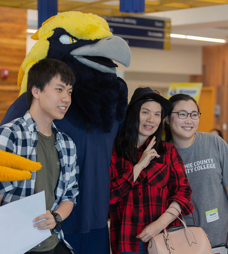 Photo of students posed with mascot Talon