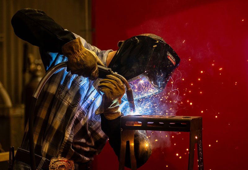 photo of a student welding at Puma Steel for the Steel Day competition