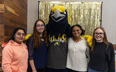 photo of LCCC students standing with mascot Talon