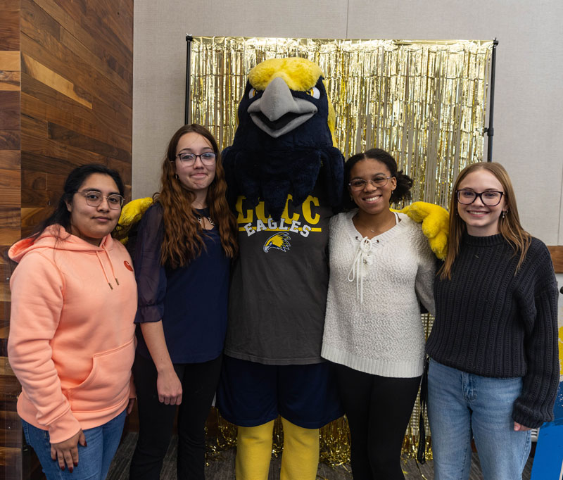 LCCC Students posing with the mascot Talon on campus