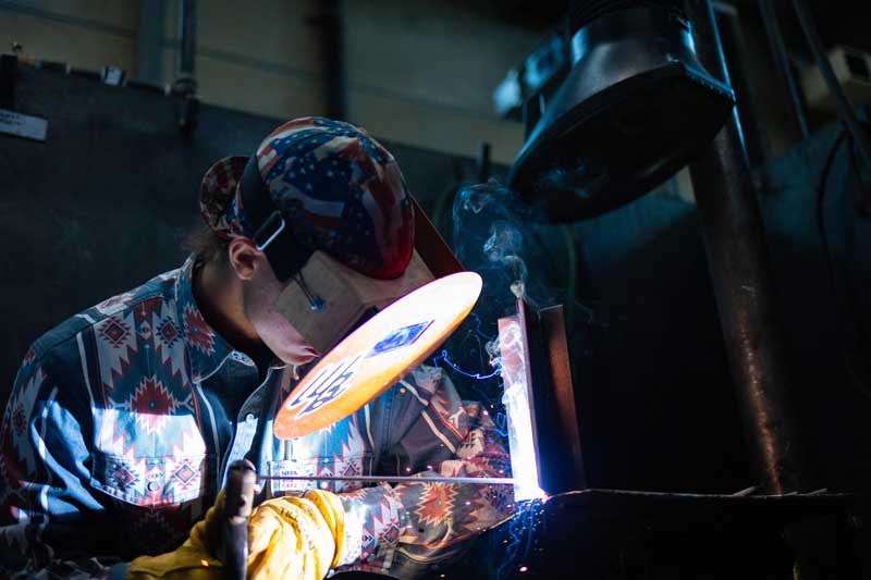 a student welding at LCCC
