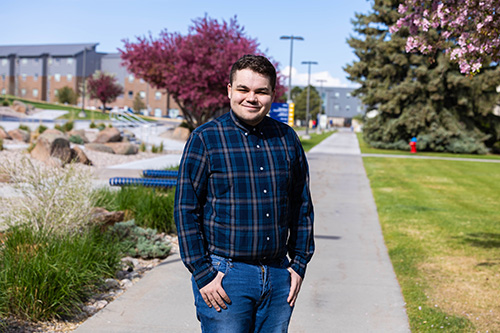 Caius Krupp stands on LCCC's campus. 