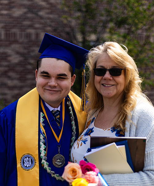 Caius Krupp with his mother after commencement.
