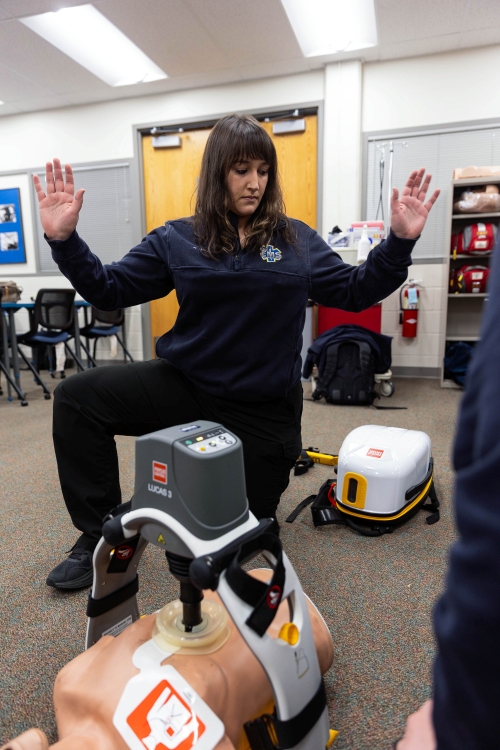 An LCCC EMS student trains with a manikin