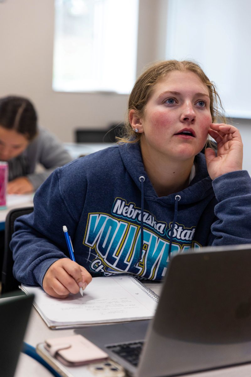 LCCC student Ali takes notes during an accounting class.