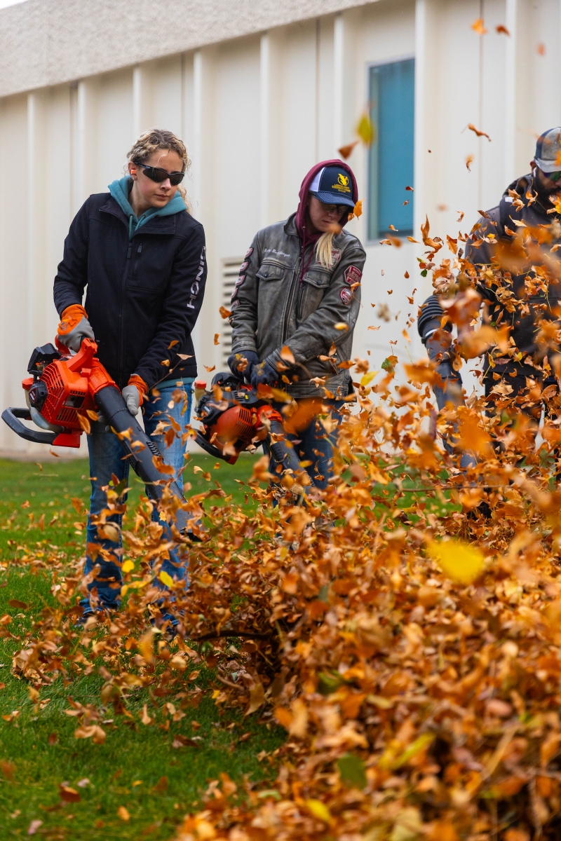 The LCCC grounds crew rakes leaves on the Cheyenne campus