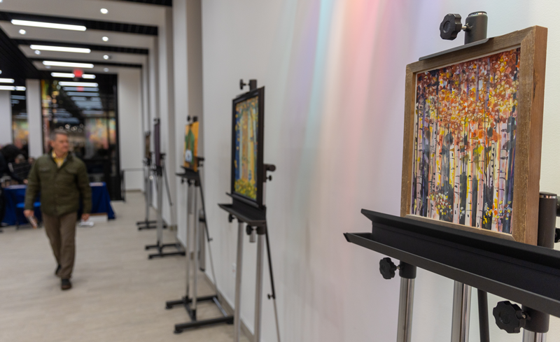 paintings on easels in the lobby of the Surbrugg/Prentice Auditorium