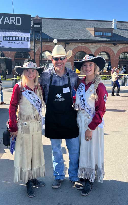 Miss Wyoming and Lady-in-Waiting MeadowAnn King with LCCC President Joe Schaffer at the Cheyenne Frontier Days pancake breakfast