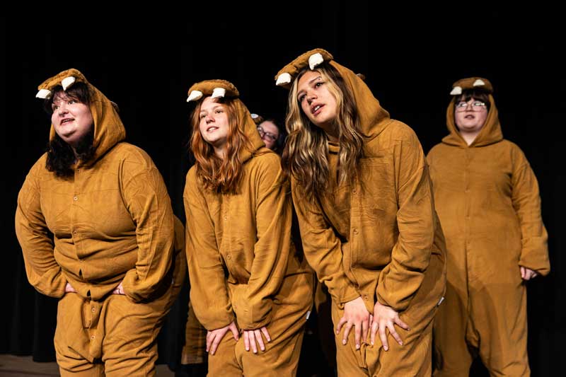 four actors dressed up in nake mole rat costumes on stage for the play