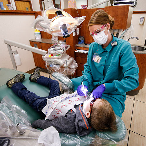 LCCC Dental Hygiene student working on child