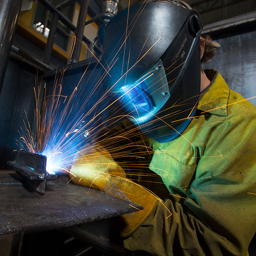 welding student working