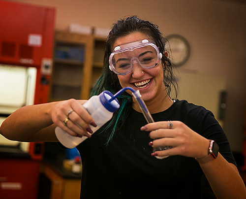 female student in chemistry class