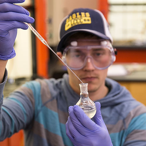 chemistry student working in class