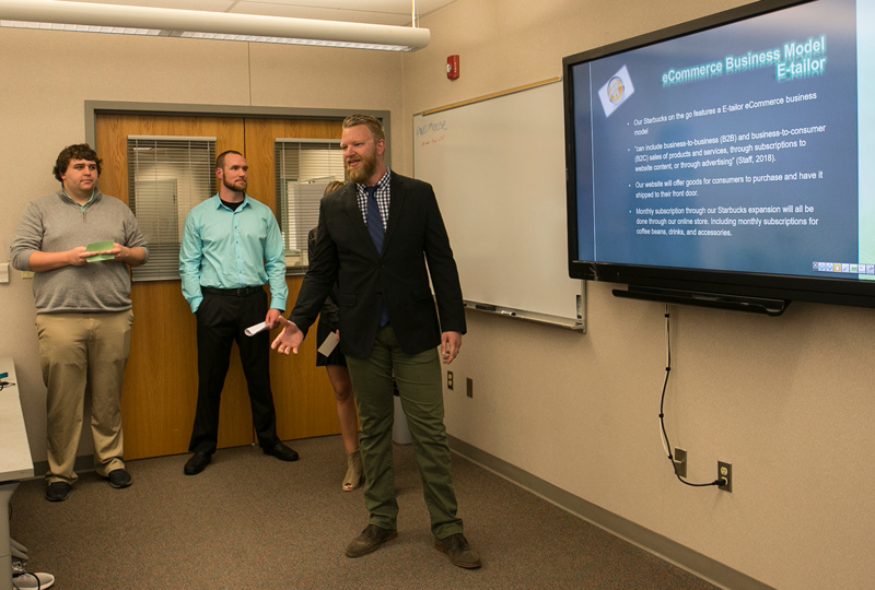 business students presenting in class