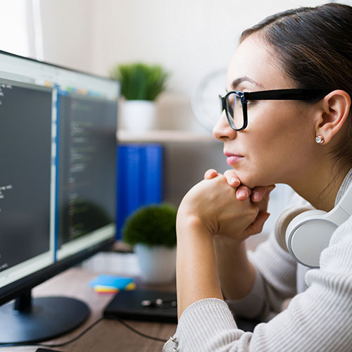 woman looking at computer monitor