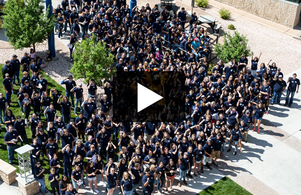 overhead view of crowd of students on LCCC campus with video play button