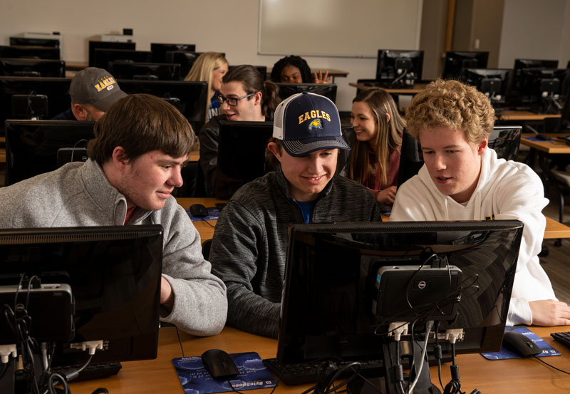 Students working on computers in a lab on campus